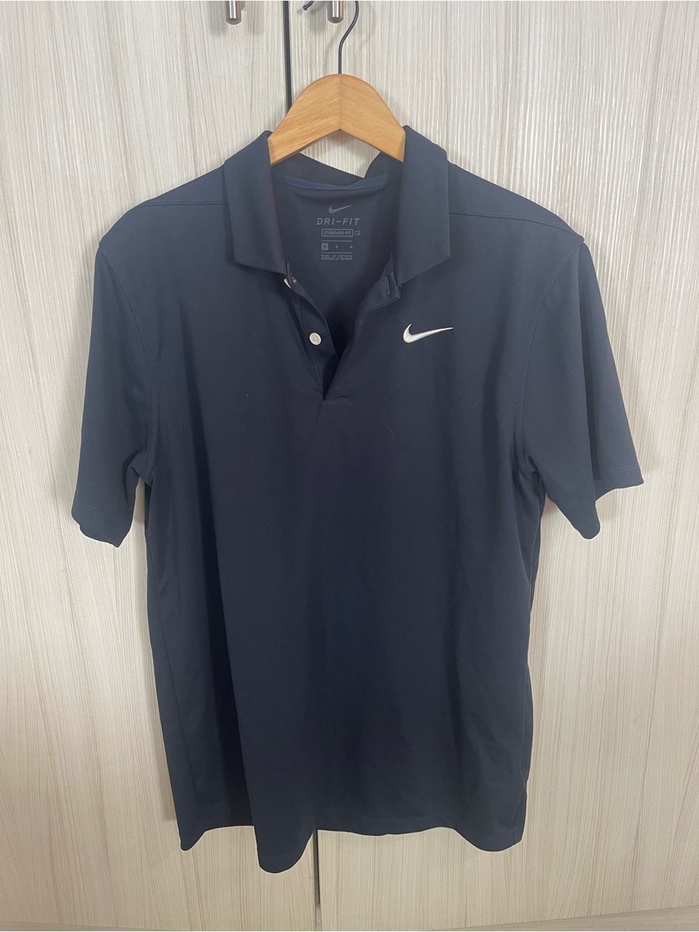 Nike Black Polo Shirt with White Swoosh
